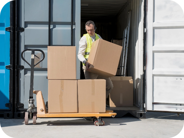 Pick and pack employee loading boxes onto jack lift