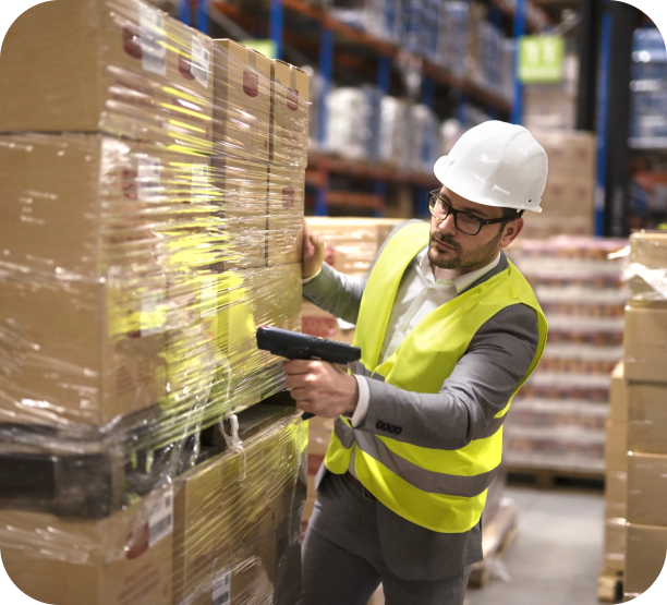 Trusted logistics manager scanning boxes in newly-received shipment